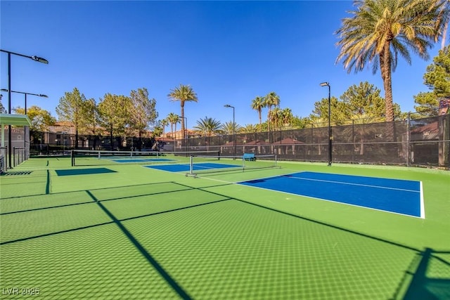 view of sport court featuring community basketball court and fence