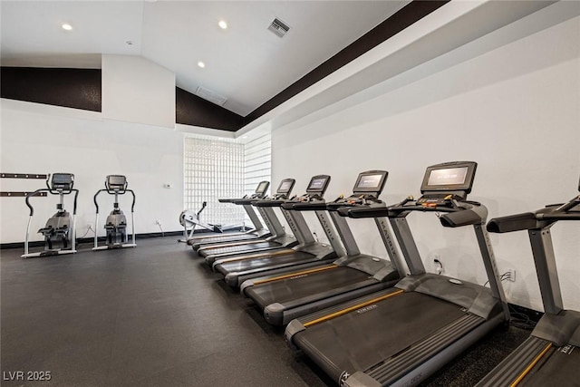 workout area featuring high vaulted ceiling, recessed lighting, visible vents, and baseboards