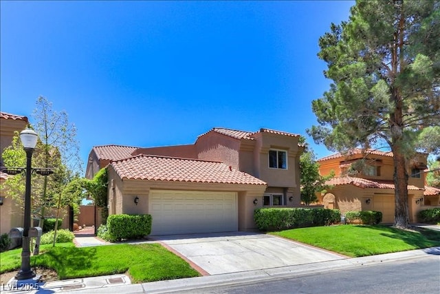 mediterranean / spanish house with stucco siding, a garage, driveway, and a tile roof