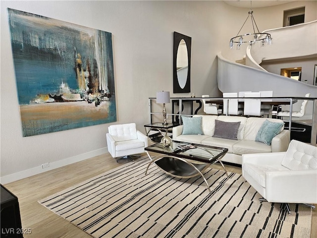 living room featuring wood finished floors and baseboards