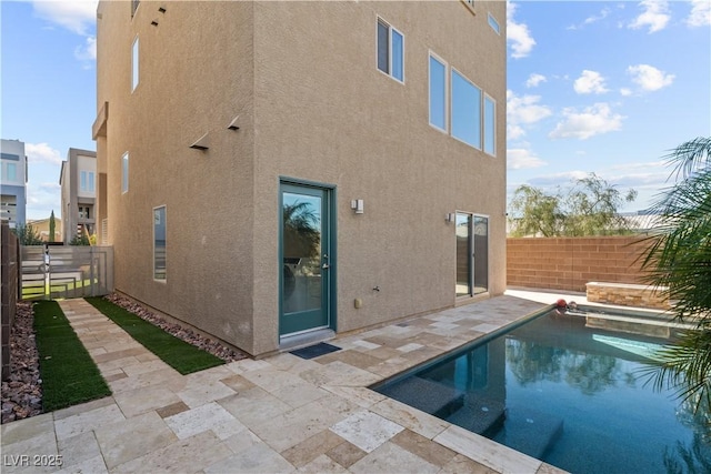 view of pool featuring a fenced in pool, a patio, and a fenced backyard