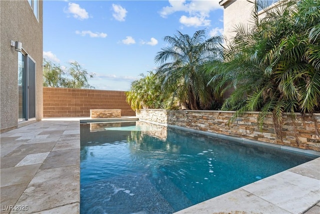 view of pool featuring a fenced in pool, a patio area, and fence