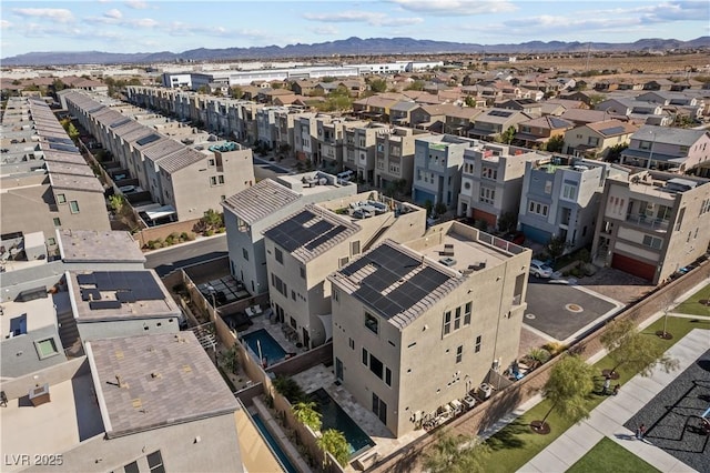 drone / aerial view featuring a residential view and a mountain view