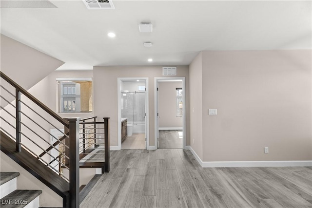 entryway with visible vents, baseboards, and light wood-style floors