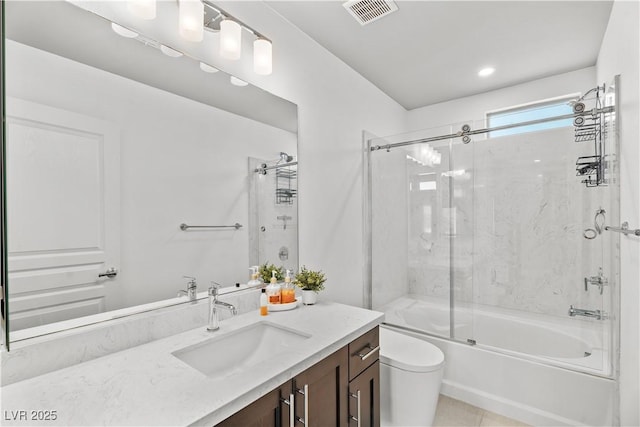 full bathroom featuring vanity, visible vents, tile patterned flooring, toilet, and combined bath / shower with glass door