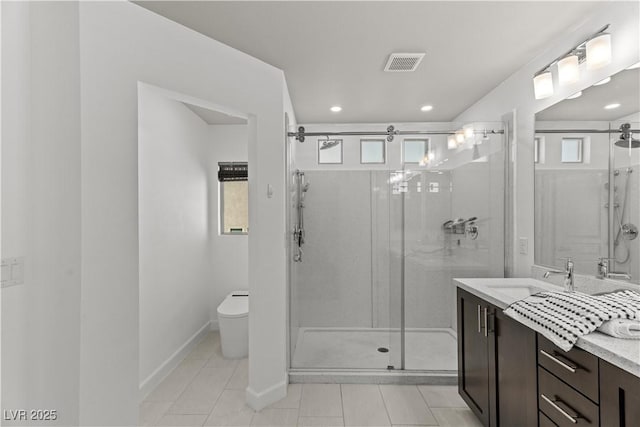 bathroom featuring tile patterned floors, visible vents, a shower stall, and plenty of natural light