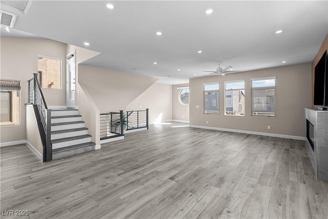 unfurnished living room with recessed lighting, light wood-style floors, and ceiling fan