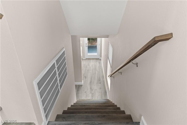 stairway with wood finished floors