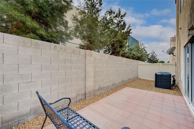 view of patio featuring central AC and a fenced backyard