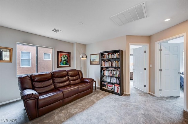 carpeted living room featuring recessed lighting, visible vents, and baseboards