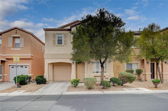 view of property featuring stucco siding, a garage, driveway, and a tile roof