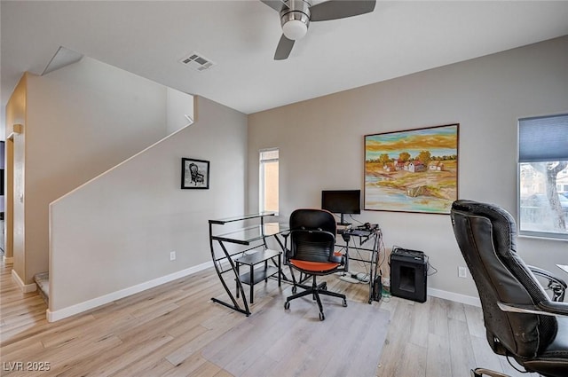 office space with baseboards, wood finished floors, visible vents, and ceiling fan