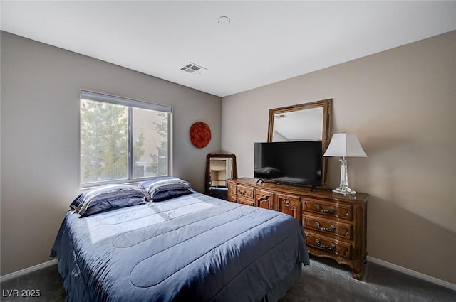 bedroom featuring baseboards, visible vents, and carpet floors