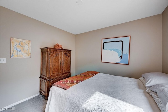 bedroom featuring carpet flooring and baseboards