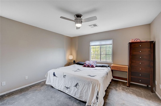 carpeted bedroom with visible vents, a ceiling fan, and baseboards