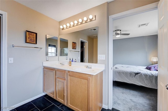 ensuite bathroom featuring visible vents, a sink, connected bathroom, tile patterned flooring, and ceiling fan