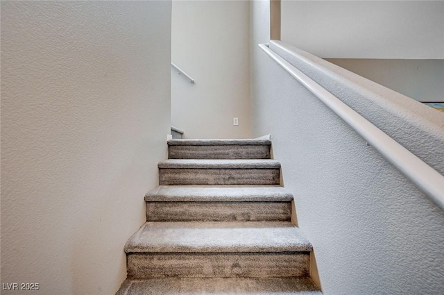 11092 Abbeyfield Rose Dr, Henderson, NV 89052 - stairs featuring a textured wall