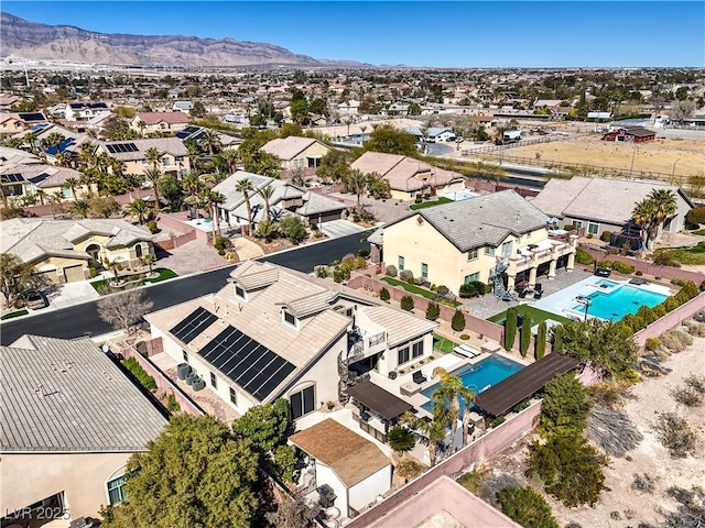 birds eye view of property featuring a mountain view and a residential view