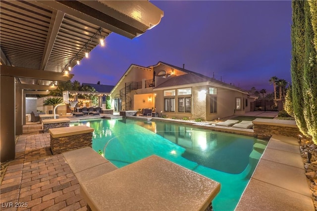 outdoor pool featuring a patio and fence