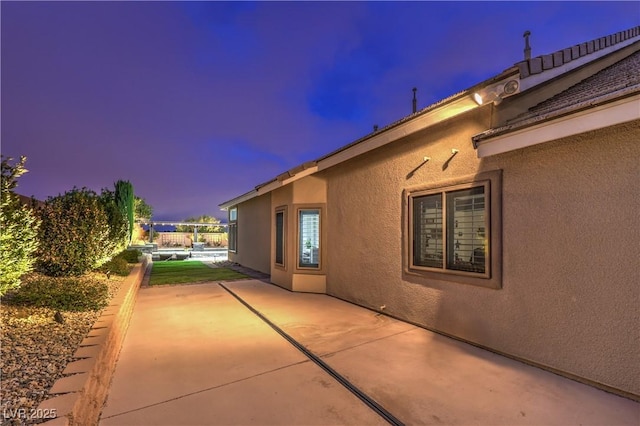 exterior space featuring stucco siding