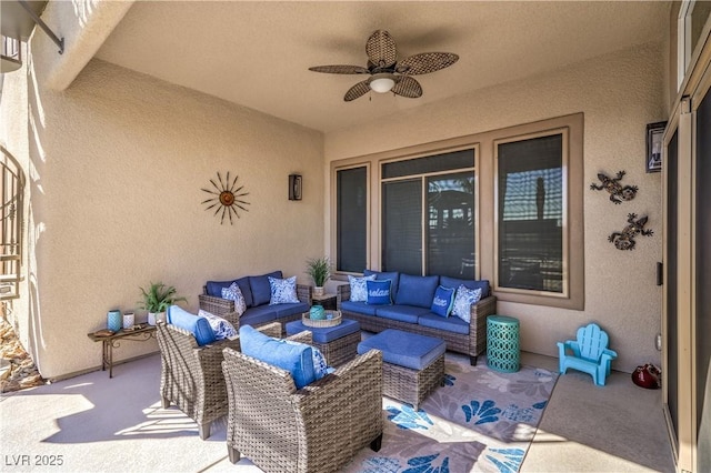 view of patio with an outdoor living space and ceiling fan