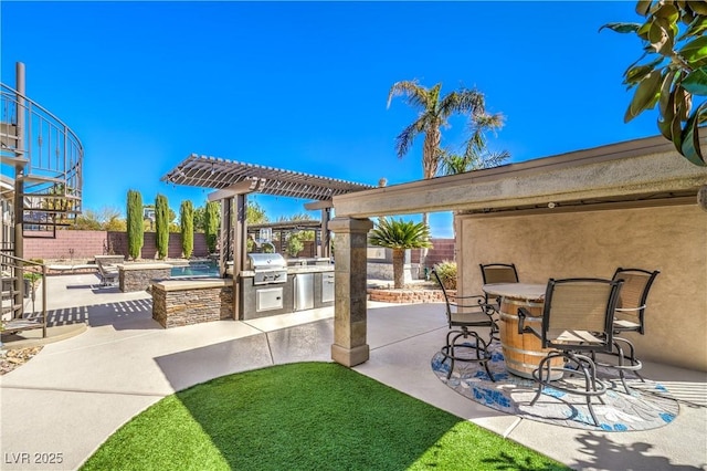 view of patio with exterior kitchen, outdoor dining area, a fenced backyard, a pergola, and a grill