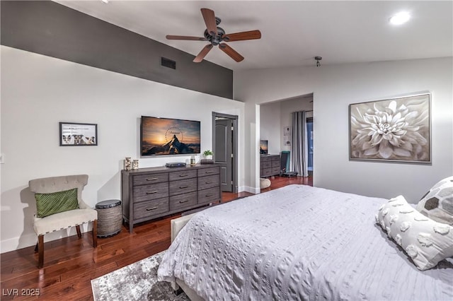 bedroom with visible vents, baseboards, ceiling fan, dark wood-style flooring, and vaulted ceiling