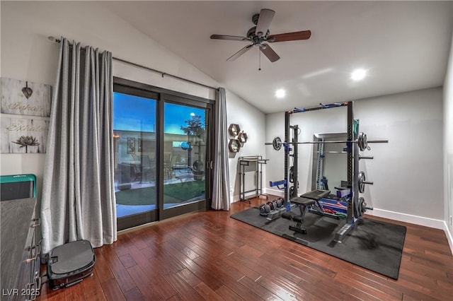 exercise area with a ceiling fan, vaulted ceiling, wood finished floors, and baseboards