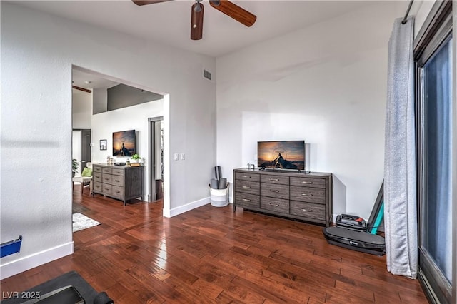 bedroom with dark wood finished floors, baseboards, visible vents, and a ceiling fan