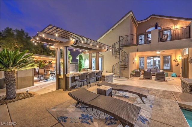 view of patio / terrace with stairway, an outdoor hangout area, a balcony, outdoor dining space, and a pergola