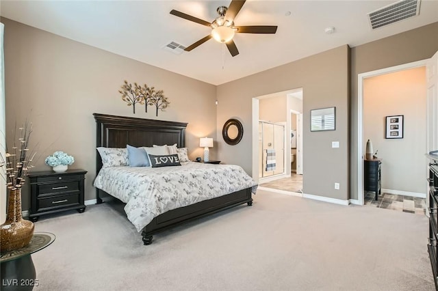 bedroom with visible vents, baseboards, and light colored carpet