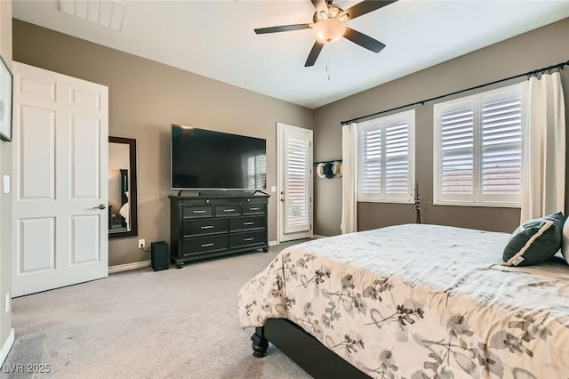 bedroom with light carpet, visible vents, ceiling fan, and baseboards