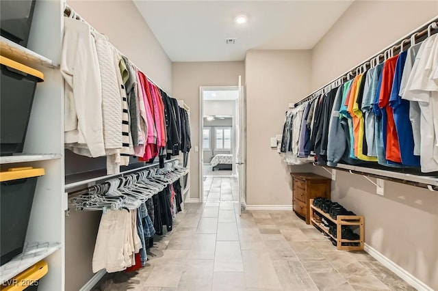 walk in closet featuring light tile patterned floors and visible vents