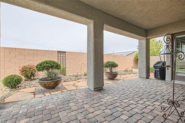 view of patio featuring a fenced backyard and grilling area