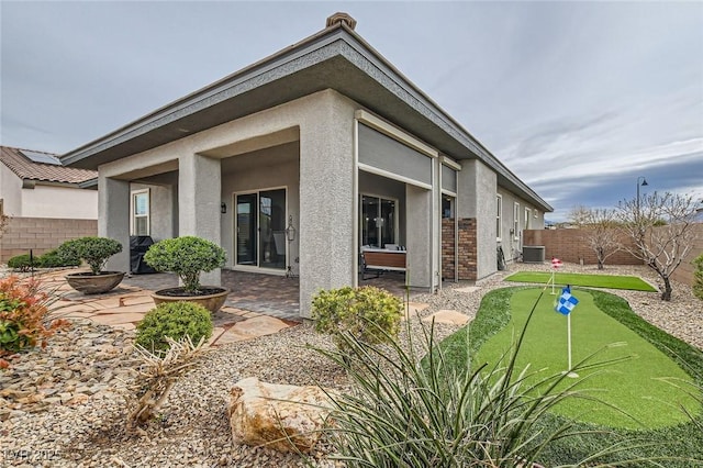 back of property featuring a patio area, a fenced backyard, and stucco siding