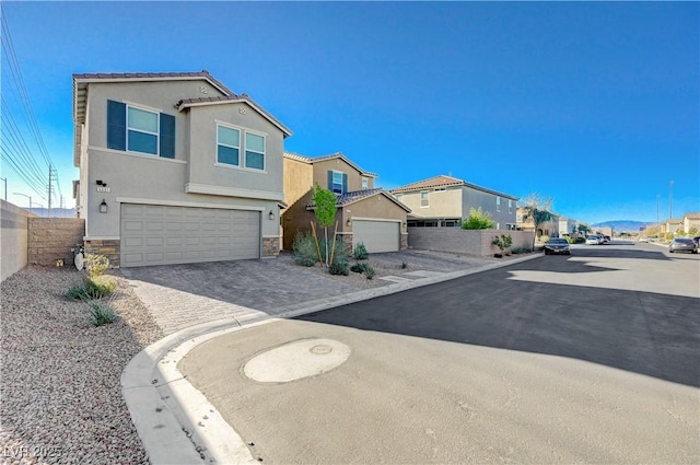 5691 Tinar St, Las Vegas, NV 89113 - view of asphalt road featuring curbs and a residential view