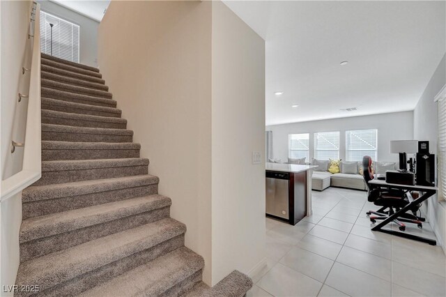 5691 Tinar St, Las Vegas, NV 89113 - stairway with tile patterned flooring and baseboards