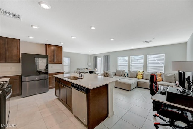 5691 Tinar St, Las Vegas, NV 89113 - kitchen featuring stainless steel appliances, a sink, open floor plan, light countertops, and recessed lighting