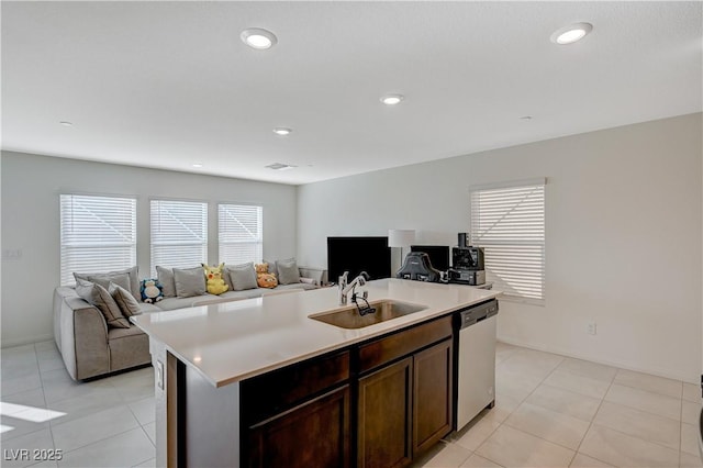 5691 Tinar St, Las Vegas, NV 89113 - kitchen featuring dishwasher, open floor plan, a sink, light countertops, and light tile patterned flooring