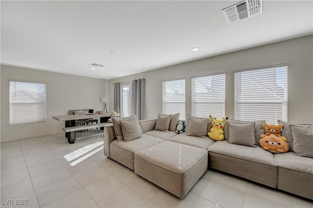 5691 Tinar St, Las Vegas, NV 89113 - living room featuring plenty of natural light, light tile patterned floors, and recessed lighting