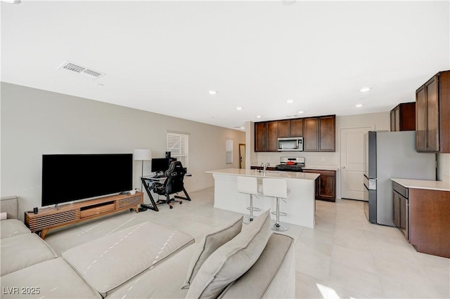 5691 Tinar St, Las Vegas, NV 89113 - living area featuring recessed lighting and light tile patterned flooring