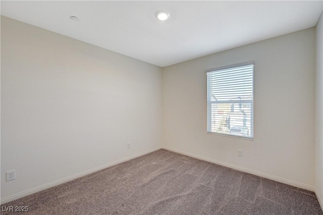 5691 Tinar St, Las Vegas, NV 89113 - carpeted spare room with baseboards