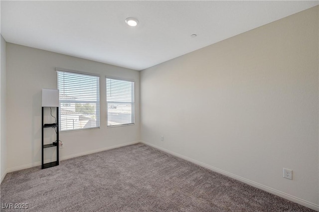 5691 Tinar St, Las Vegas, NV 89113 - spare room with baseboards and carpet