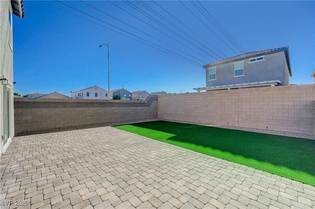 5691 Tinar St, Las Vegas, NV 89113 - fenced backyard with a patio