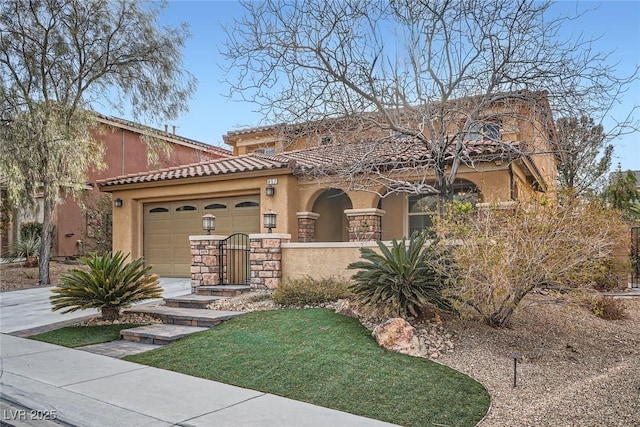 mediterranean / spanish house featuring a tile roof, an attached garage, concrete driveway, and stucco siding