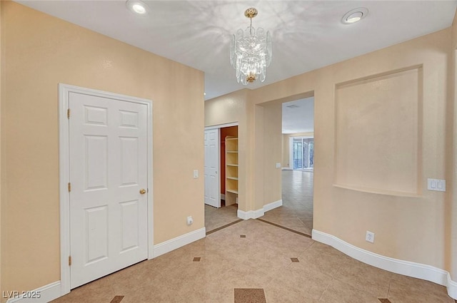 unfurnished bedroom with recessed lighting, baseboards, a notable chandelier, and tile patterned flooring