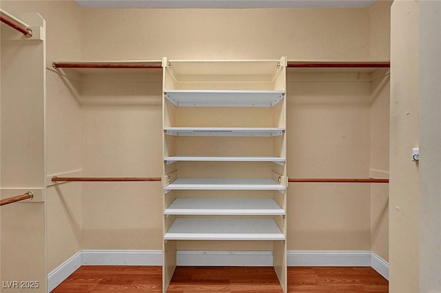 spacious closet with wood finished floors