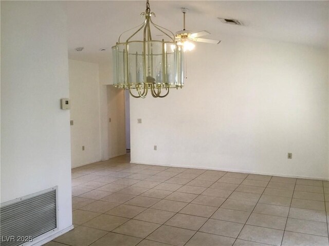 unfurnished room with light tile patterned floors, visible vents, and ceiling fan with notable chandelier