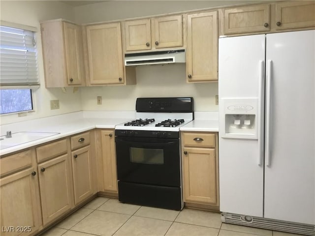 kitchen with range with gas cooktop, under cabinet range hood, light brown cabinetry, light countertops, and white refrigerator with ice dispenser