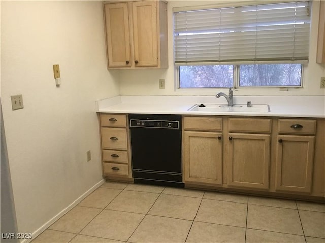 kitchen featuring light tile patterned floors, dishwasher, light countertops, and a sink